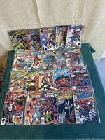 Overview of 20 Spider-Man comics arranged on table