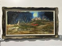 Frontal image of large vintage oil painting with dark blue night sky, full moon, house on hill, and abstract terrain in gold tone ornate frame.