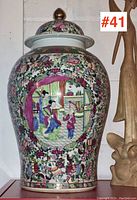 Full view of the ginger jar showing detailed hand-painted scene and floral decorations