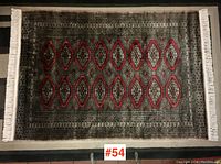 Full view of carpet showing overall design, borders, and fringe