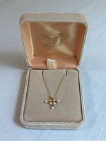 Necklace displayed in original velvet-lined presentation box with Met logo on lid lining