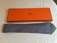 Tie and box displayed flat