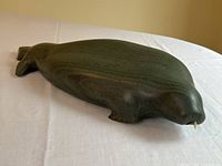 Front-left angle view of entire sculpture on white cloth