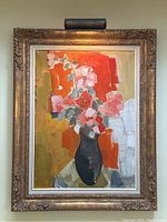 Full view of framed oil painting with picture light mounted above