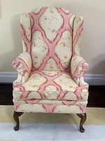 Front view showing full chair silhouette, wingback and cushion