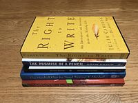 Stack of five paperback books on writing with visible titles and authors.