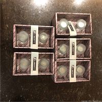 Six boxes containing ten round sea glass style drawer pulls with frosted appearance.