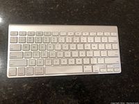 Top view of Apple wireless keyboard showing key layout and condition.