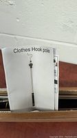 Photo of printed sheet showing a picture and label 'Clothes Hook pole'