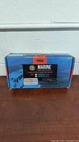 Original blue box packaging of Pyle Marine Amplifier System with front label showing product features and images.