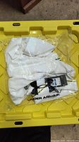 White men's Under Armour golf shirt size XL, brand new in plastic packaging with tags attached.