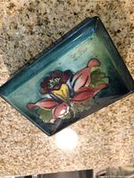 Top view of the lid showing hand-painted flower and glaze colors