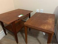 Front view of both tables showing different designs and overall appearance