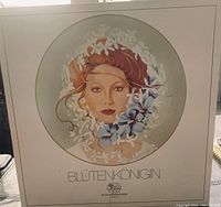 Front of original box showing the painted portrait of a woman with floral decoration and text stating 'Blütenkönigin' by Hutschenreuther, Germany.