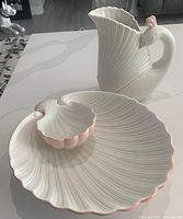 Photo of the chip/dip bowl and swan pitcher together on a white surface showing details and scale.