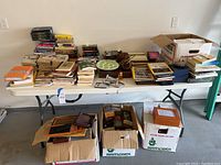 Full overview of the table with books, decor items, boxes below