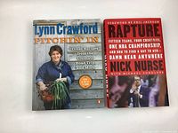 Photo shows Lynn Crawford Pitchin' In cookbook and Nick Nurse Rapture basketball book side by side on a white background.