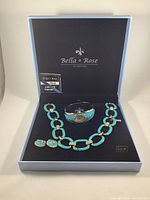 Full view of the vintage Bella & Rose jewelry set displayed in its original box. Set includes necklace, earrings, and watch bracelet.