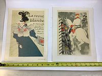 Two vintage French poster prints laid side by side showing La Revue Blanche and a mounted rider on a horse.