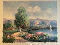 Full view of the oil painting depicting a serene lakeside landscape with flowers, a woman on a path, houses and a sailboat in the distance.