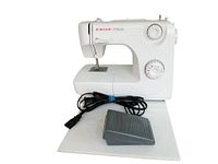 Front view of Singer Prelude sewing machine model 8280 with foot pedal and power cord laid in front.