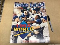 Front cover showing Blue Jays players celebrating 1992 World Series win with prominent text.