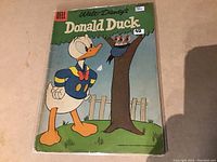 Front cover of vintage Donald Duck comic, issue #42, by Dell publishing 1957, featuring Donald Duck and bird nest artwork.