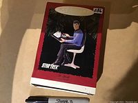 Front view of the box showing image of Mr. Spock seated with console and Star Trek branding