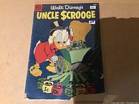 Front cover of Uncle Scrooge #10 comic book showing Uncle Scrooge and coin-operated machines.