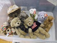 Plastic bin containing multiple assorted TY Beanie Babies and Buddies including bears and moose with tags