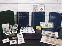 Group shot of entire lot including coin sets, graded coins, loose coins and album folders