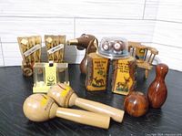 Seven vintage salt and pepper sets in varied shapes and materials including wood and plastic.