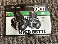 Instruction manual front cover showing illustrations of Kiev 88 TTL cameras