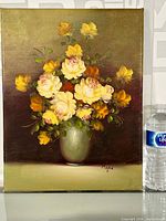 Frontal view of the oil painting showing the full bouquet and green vase against a muted background with the artist's signature visible.