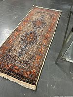 Full-length view of the runner rug showing overall dimensions and medallion arrangement