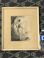 Framed ink drawing showing full view of the artwork including the frame and the humidity of the image with water bottle for scale.