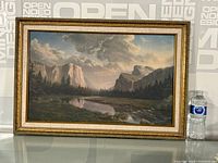 Full view of the framed print showing the landscape and frame.