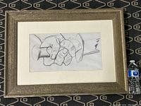 Framed lithograph showing full artwork and frame with water bottle for scale.