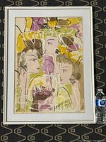 Full view of Vitali Marchenko painting showing three stylized female heads with abstract colored background and white paint overlay. Framed and laid on patterned fabric with water bottle for size.