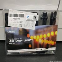 Closed packaging of 2 packs of Btfarm solar powered LED string fairy lights, showing product label and brand SL21 model.