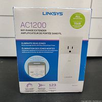 Front view of the Linksys AC1200 Wi-Fi Range Extender box showing model RE6350. Highlights eliminate dead zones, speeds up to AC1200 (N300+AC867 Mbps), and easy setup with 1-2-3 configuration.