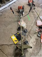 Overview of main STIHL trimmer unit with straight shaft and bicycle handlebars