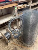 Photo of assorted wire, cable on spools and large roll of stainless steel mesh