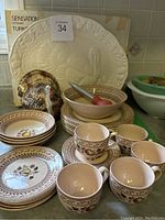 Full set of Johnson Bros Fruit Sampler fruit motif plates, bowls, cups, handpainted turkey figurine, and ceramic turkey platter.