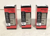 Three boxed Pass & Seymour USB charger switches shown side by side, packaging visible with branding and product details.