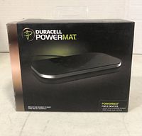 Front view of the Duracell PowerMat retail box showing the charging pad image and branding.