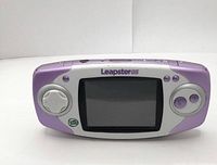 Front view of LeapFrog LeapsterGS showing screen, buttons and D-pad with branding