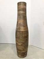 Photo of an extra large wooden floor vase 23 inches tall showing natural wood grain and striped pattern.
