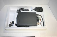 Apelco VHF 5160 marine radio transmitter with microphone inside styrofoam packaging.