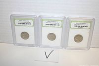 Photo of three 2003-P Jefferson nickels in clear plastic slabs with grading labels shown against a white background with a check mark card.